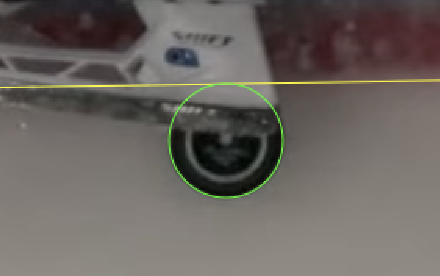Zoomed-in view of the puck on the goal line, with the line and circle still annotated